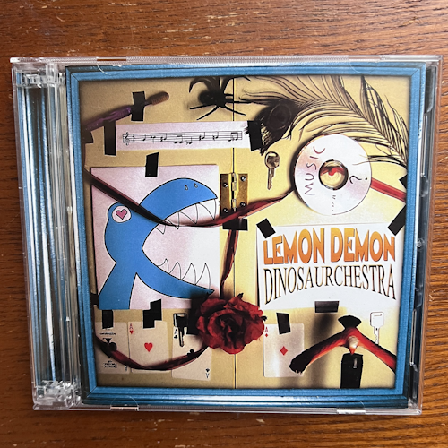 Photograph of a CD of Dinosaurchestra by Lemon Demon