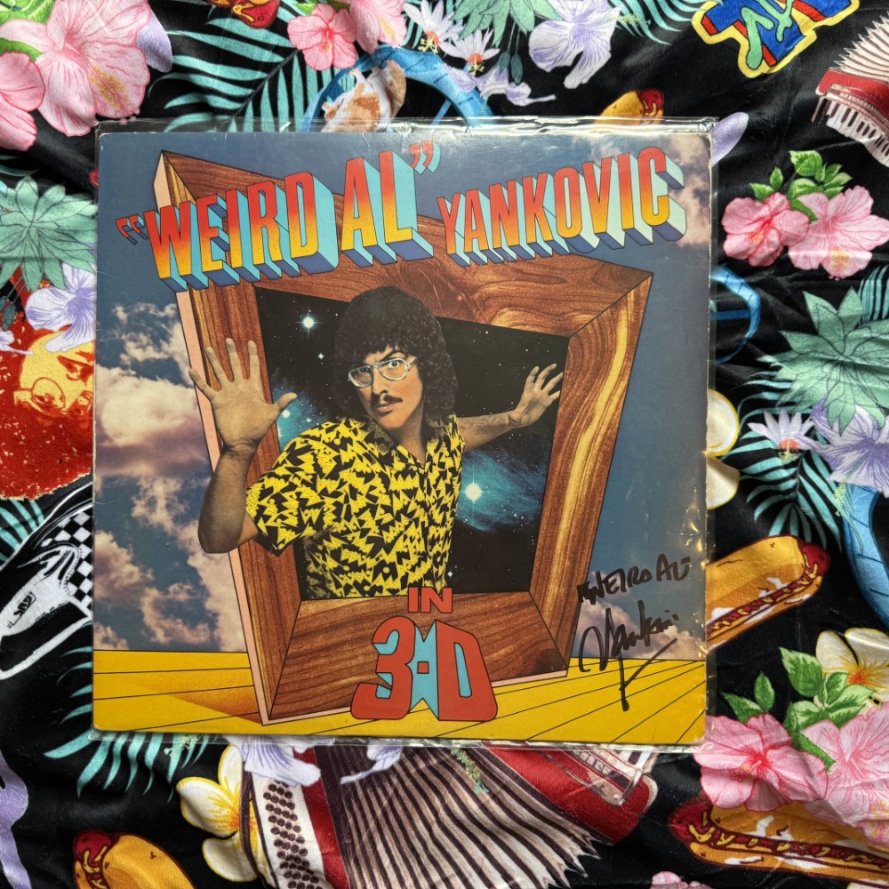 Photograph of an autographed LP of In 3-D by Weird Al Yankovic