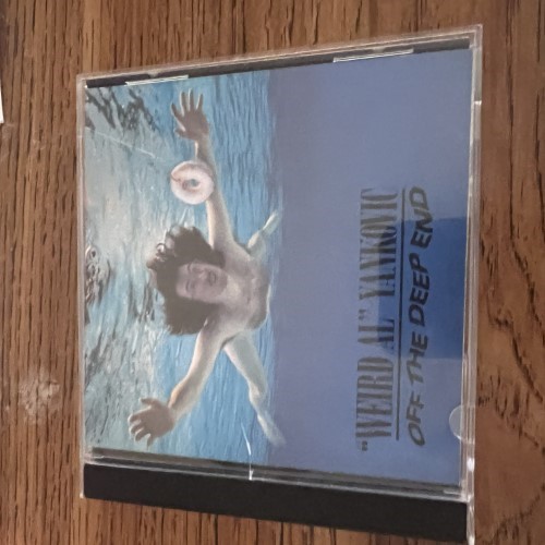 Photograph of a CD of Off the Deep End by Weird Al Yankovic
