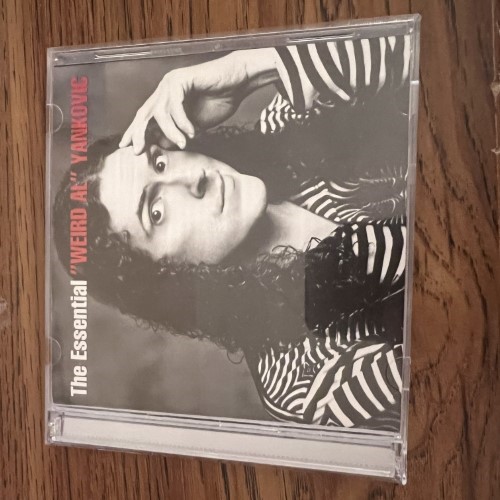 Photograph of a CD of The Essential Weird Al Yankovic by Weird Al Yankovic