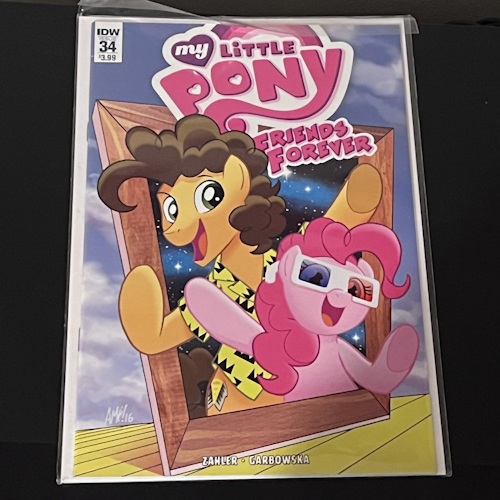 Photograph of a My Little Pony comic book 'Friends Forever issue 34' with the cover art resembling that of Weird Al Yankovic's 1984 album In 3-D, featuring the characters Pinkie Pie, and Cheese Sandwich, the latter having been voiced in the show by Weird Al Yankovic.