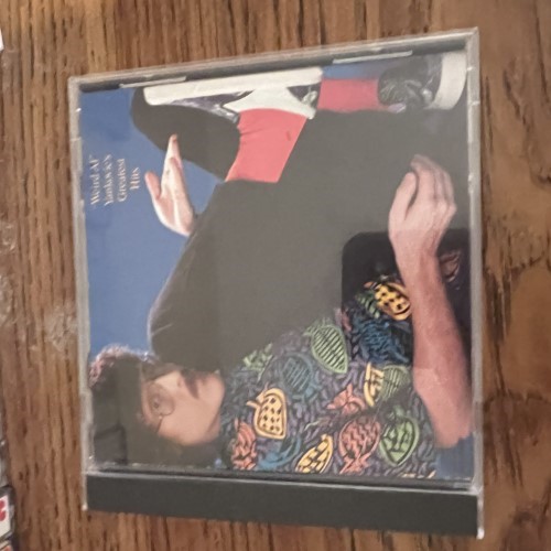 Photograph of a CD of Weird Al Yankovics Greatest Hits by Weird Al Yankovic