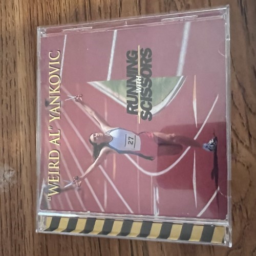 Photograph of a CD of Running With Scissors by Weird Al Yankovic