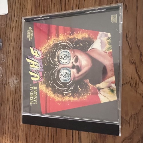 Photograph of a CD of UHF: Original Motion Picture Soundtrack And Other Stuff by Weird Al Yankovic
